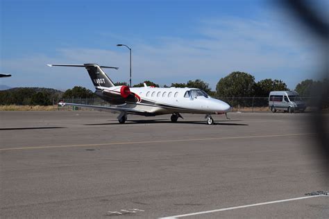 Private Cessna Citation jet taxiing at Sedona Airport with cliffs and mesas in view