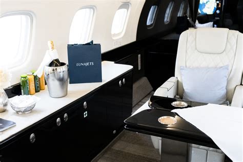 private jet flight attendant preparing cabin during night flight