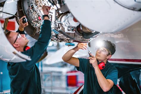 private jet undergoing full maintenance check in hangar