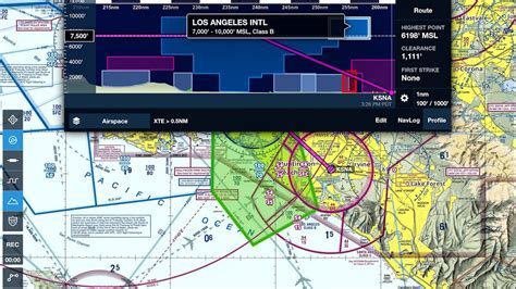 private pilot reviewing VFR charts and flight logbooks in briefing room