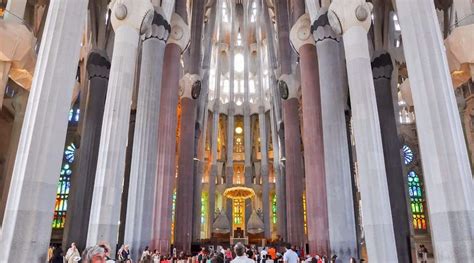 protest banner in front of sagrada família reading “our homes are not your holidays”