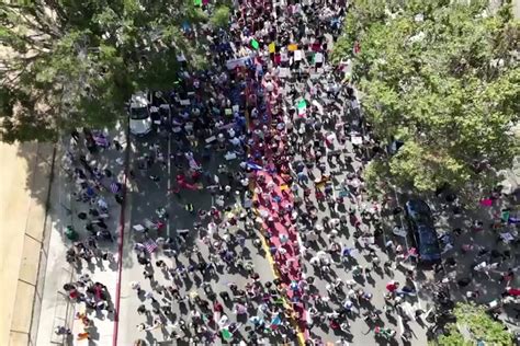 Protest march in downtown Los Angeles with international news crews filming