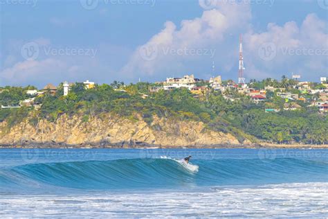 puerto escondido surf beach aerial with canadian tourists relaxing on coast