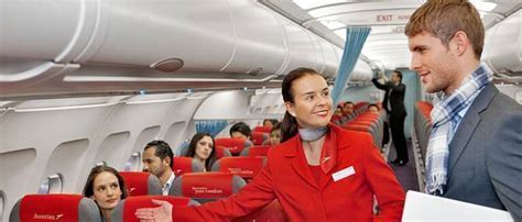 Purser and flight attendants preparing for passenger boarding at Billy Bishop Airport