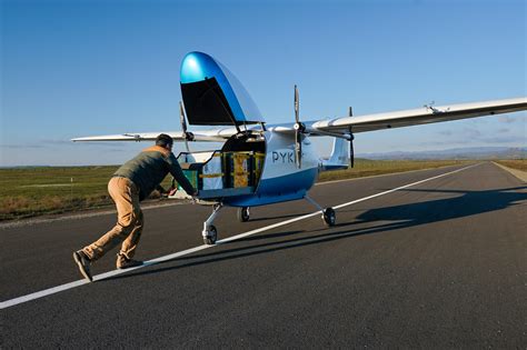 pyka engineering team prepping pelican cargo drone for warehouse logistics test