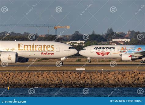 Qantas Express cargo aircraft on tarmac in Sydney, awaiting strike action decision