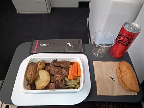Qantas international economy class meal tray with various dishes