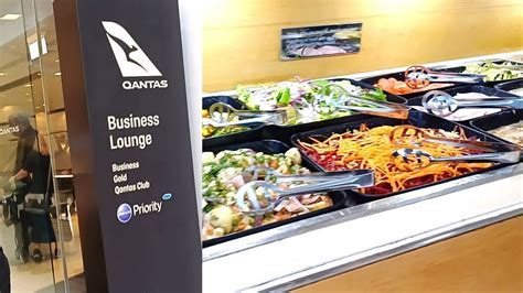 Qantas Loyalty signage and lounge entry at Sydney Airport International Terminal