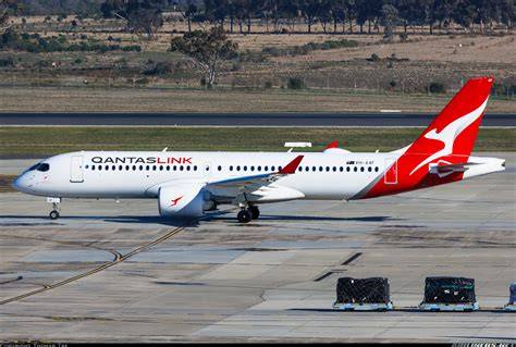 QantasLink Airbus A220-300 parked at Australian regional airport terminal
