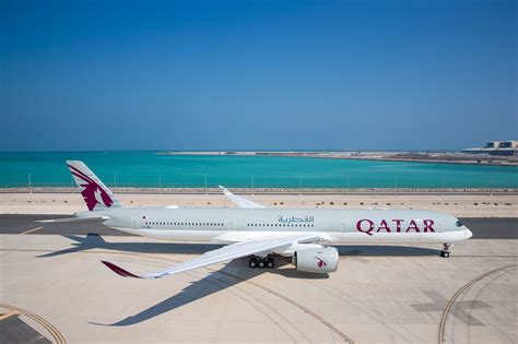 Qatar Airways Airbus A350-900 parked at Hamad International Airport at night