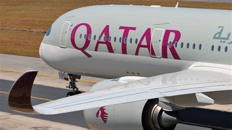 Qatar Airways engineers inspecting A350 before short-haul departure