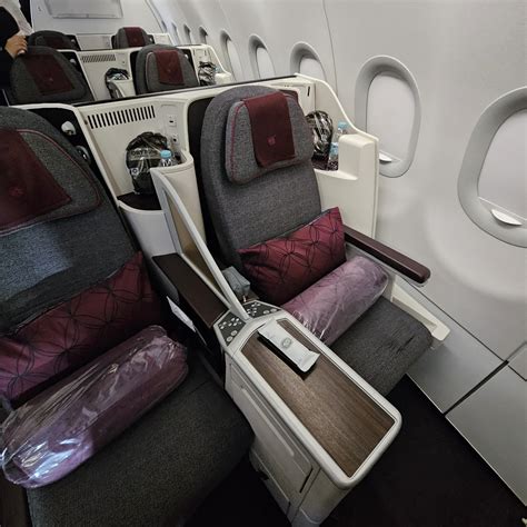 Qatar Airways lie flat business class bed with bedding setup