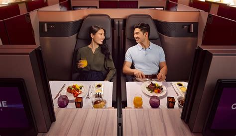 Qatar Airways premium cabin service champagne and luxury table setting