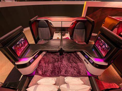 Qatar Airways Qsuite business class cabin with Starlink WiFi