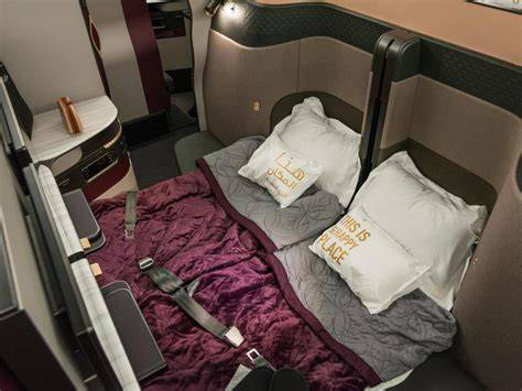 Qatar Airways Qsuite business class double suite with sliding door and bespoke stitching