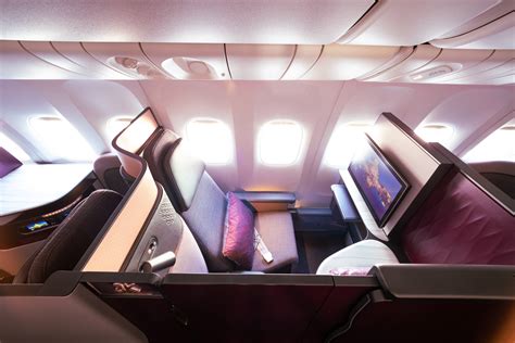 Qatar Airways Qsuite business class private door luxury aircraft cabin