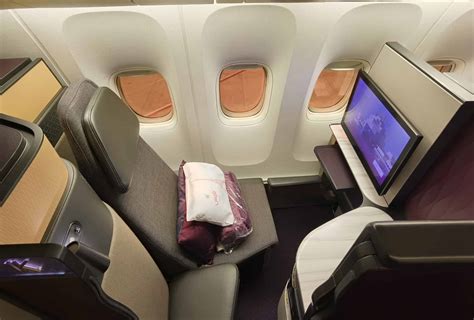 Qatar Airways Qsuite business class seat with sliding privacy door