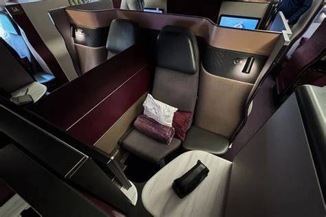 Qatar Airways Qsuite private business class suite closed door double bed quad configuration