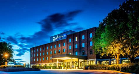Radisson Blu Arlandia Hotel exterior at dusk near Stockholm Arlanda Airport