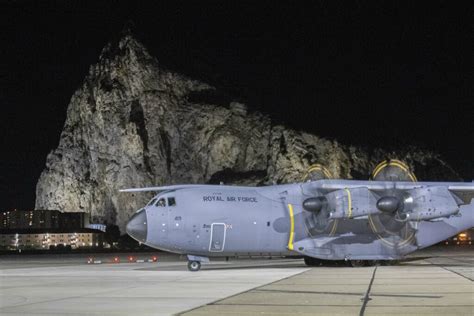RAF Gibraltar runway beside the Rock of Gibraltar military transport aircraft