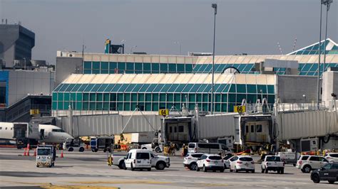 rain-drenched runway at LaGuardia Airport during regional airline delays