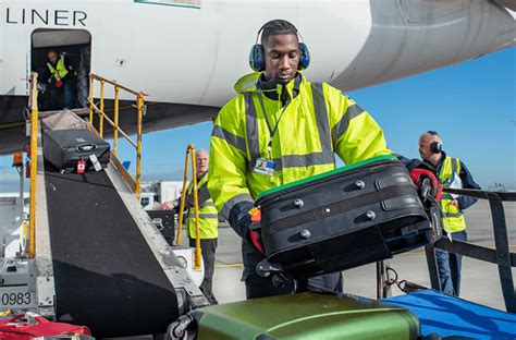 ramp agents preparing aircraft for boarding during winter operations