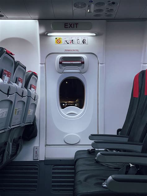 recovery crews near emergency exit row where sole survivor was seated