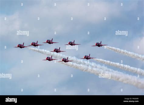 Red Arrows Hawk jets flying formation over UK airshow