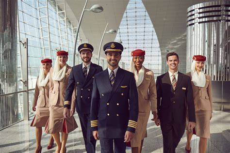 Regional airline pilots walking across ramp with flight bags and uniforms