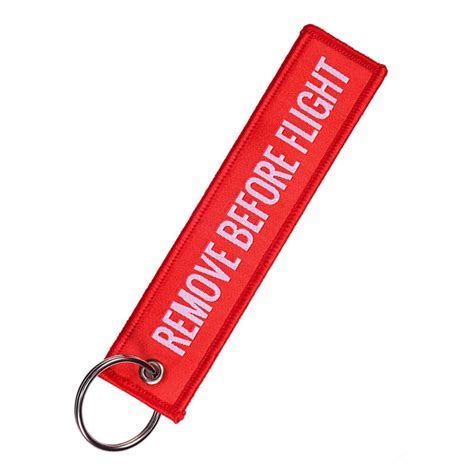 remove before flight keychain on aviation enthusiast’s gear bag