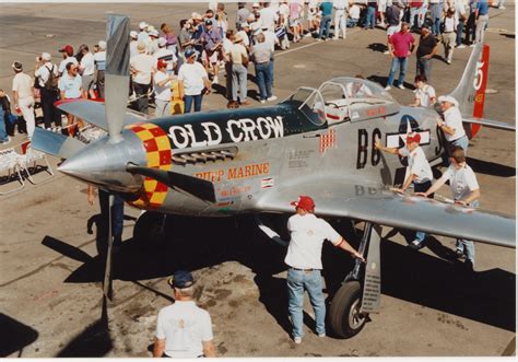 Restored flying P-51 Mustang warbird at modern airshow