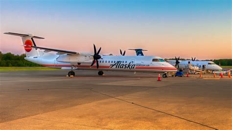 Retired Alaska Airlines Q400 aircraft at sunset, parked at SEA