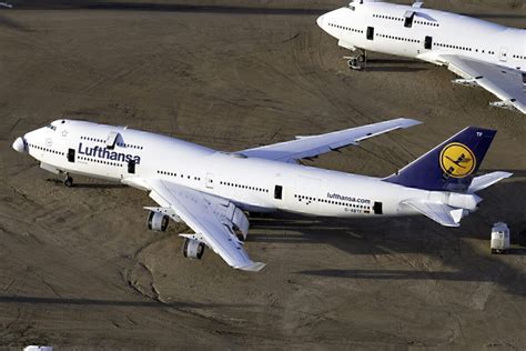 retired boeing 747 in desert storage facility under clear sky