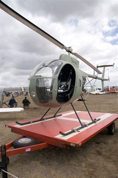 revolution mini 500 painted in custom livery at small airfield