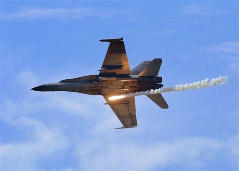 RMAF Su-30MKM flying in formation with F/A-18D Hornet