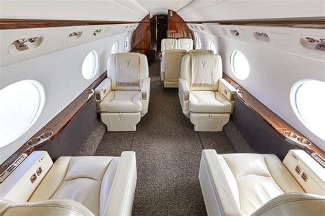 Robert Herjavec Gulfstream G550 interior light wood luxury cabin family seating