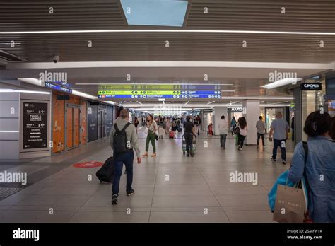 roma termini concourse with shops and metro signage