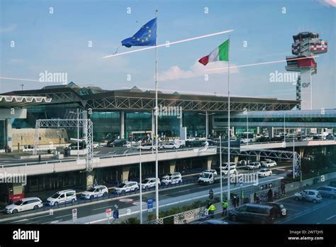 rome fiumicino airport boarding gate with delta air lines jet visible outside
