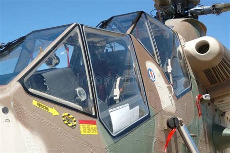 Rooivalk tandem cockpit interior with pilot helmet and avionics display
