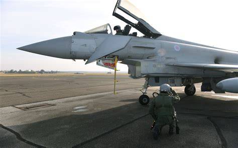 Royal Air Force Eurofighter Typhoon fighter pilot preparing for a combat training sortie