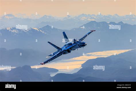 Royal Canadian Air Force CF-18 Hornet flying during sunset patrol mission over northern Canada