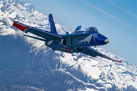 Royal Canadian Air Force fighter pilot beside a CF-18 Hornet at a Canadian air base