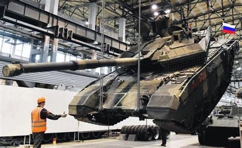 russian defense workers assembling t-90m turret components amid wartime production surge