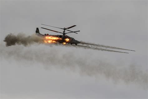 Russian Ka-52 Alligator attack helicopter performing combat maneuver