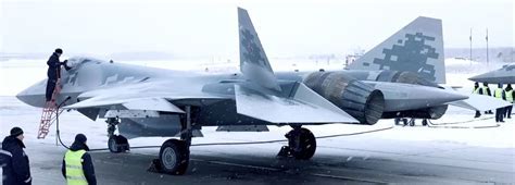 Russian Su-57 Felon stealth fighter taxiing on snow-covered tarmac