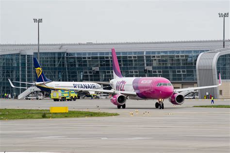 Ryanair and Wizz Air Boeing 737 MAX aircraft at London Luton Airport apron during boarding operations