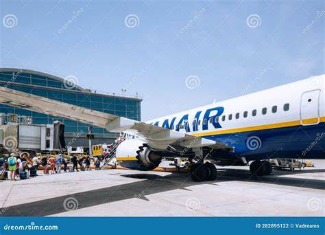 Ryanair boarding gate at Alicante-Elche Airport with passengers waiting for rescheduled flight