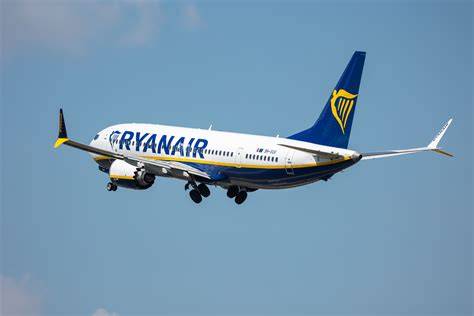 Ryanair Boeing 737-800 arriving at Alicante-Elche Airport terminal in Spain