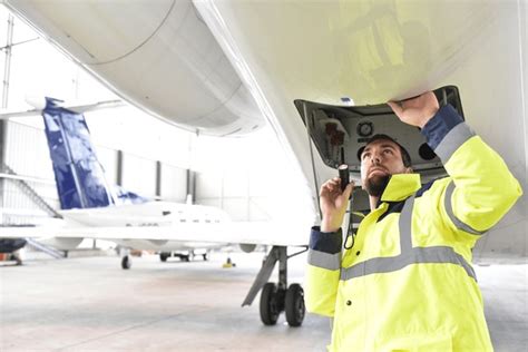 SAA engineers conducting safety inspection on Airbus A320 at maintenance hangar in Johannesburg