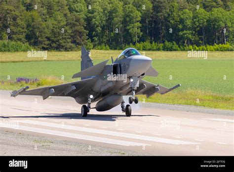 Saab JAS 39 Gripen on runway preparing for takeoff